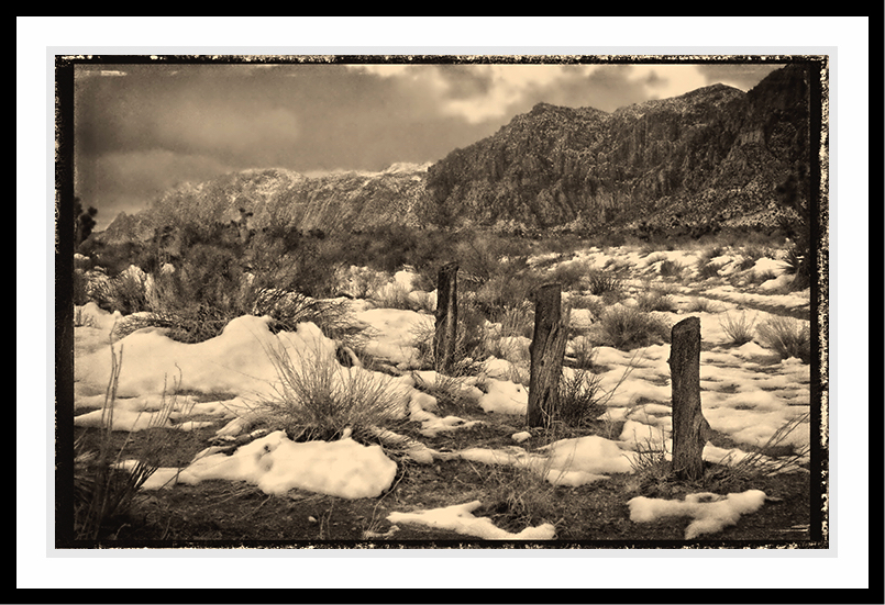 Remmants of a mountain fence in snow.